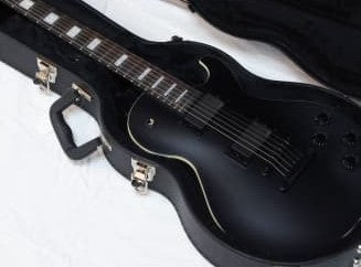 Dean TB STH7 BKS. Thoroughbred Stealth 7 Strings Electric Guitar w/EMG Pick-up, Black Satin finish. Includes Dean Hard Shell Case.